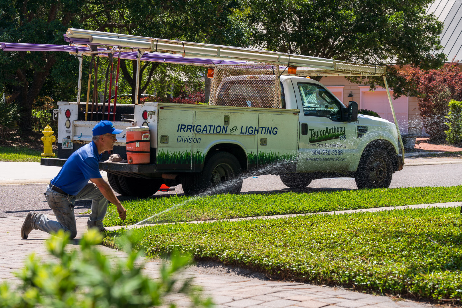 irrigation technician calibrating a sprinkler head 8