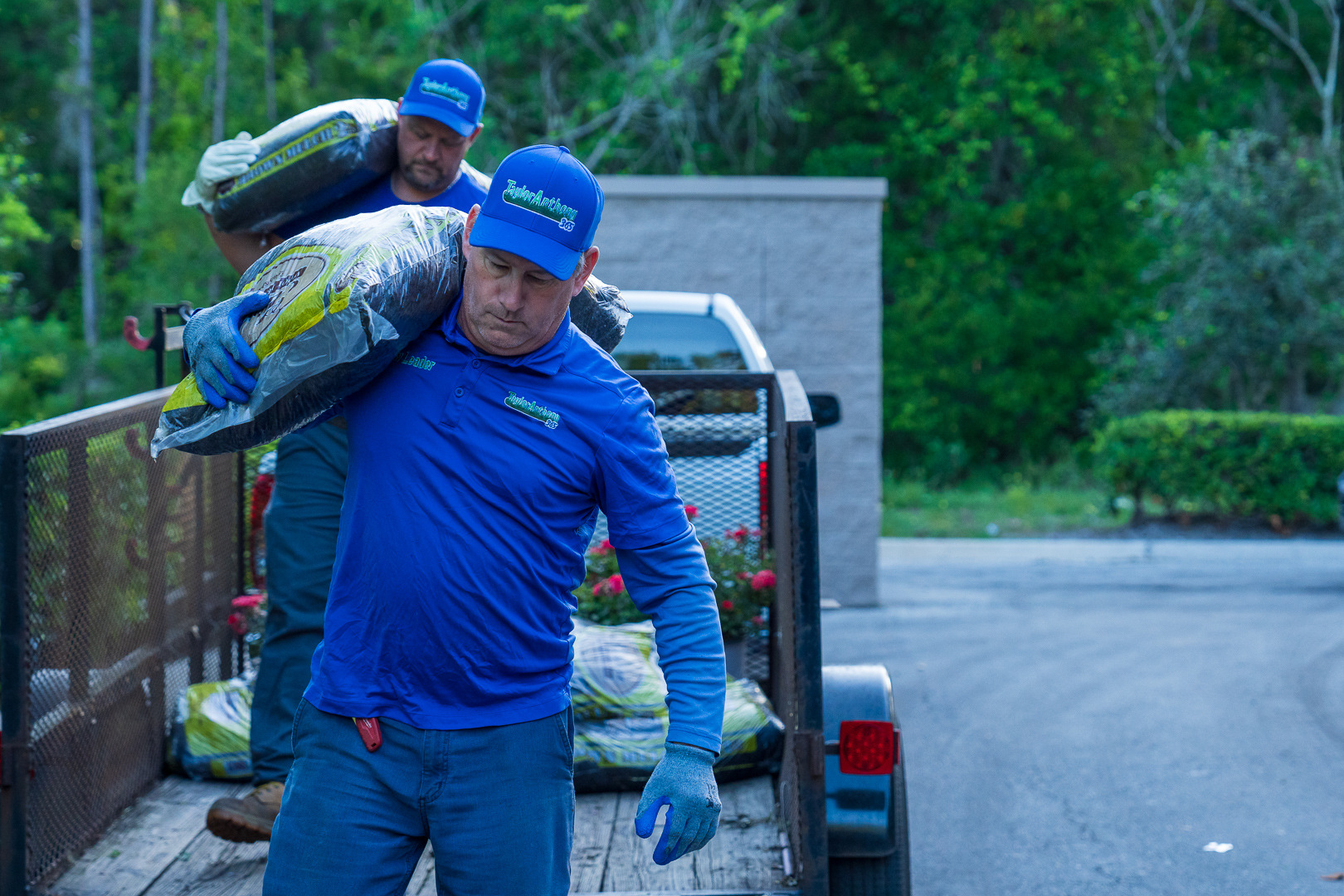 tea member loading plants and mulch into trailer 5