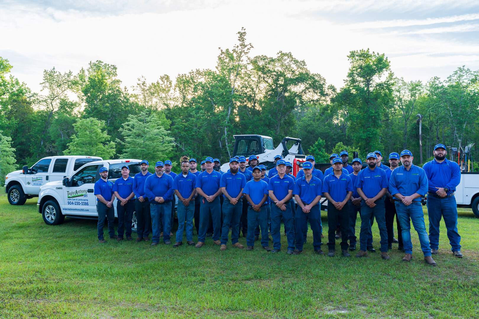 team photo with crew trucks