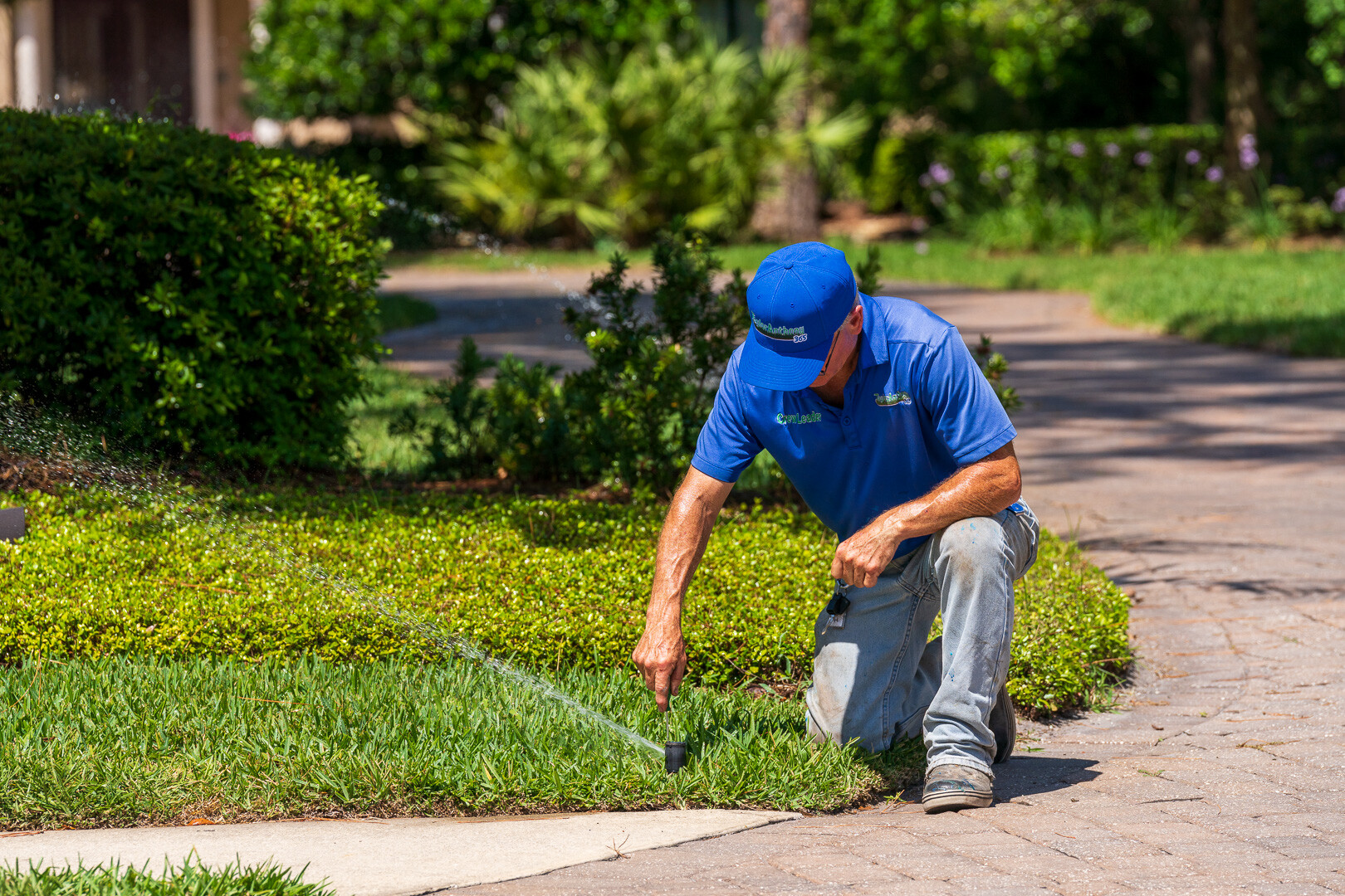 irrigation technician calibrating a sprinkler head 5