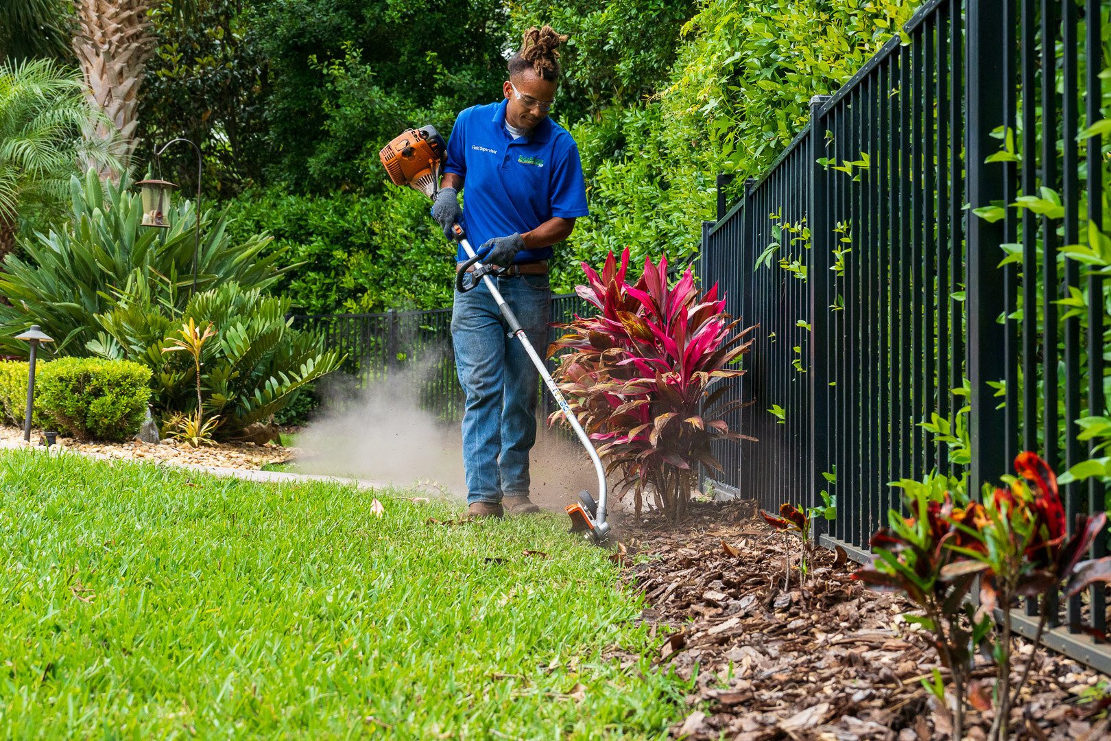 residential maintenance technician edging planting beds 2