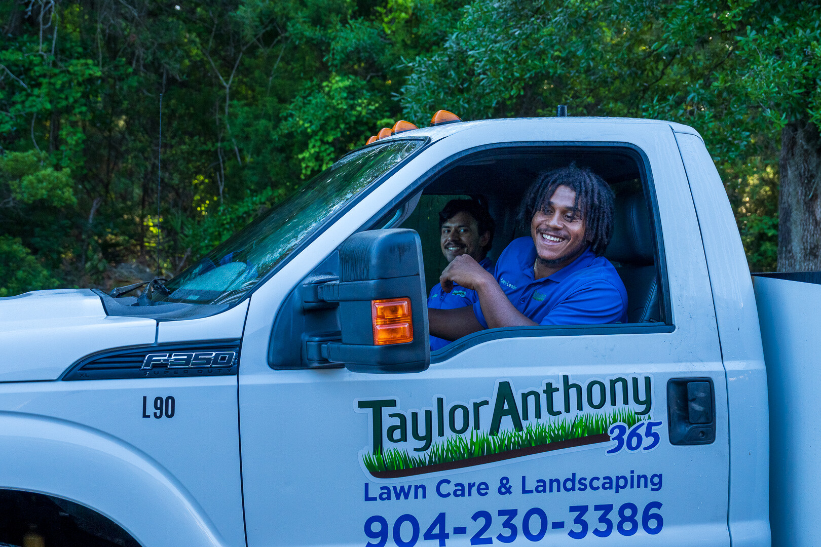 team member smiling in truck